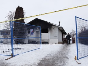 Edmonton Fire Rescue Services battle a blaze following an explosion at a house on 102 Street near 120 Avenue on Monday, Dec. 3, 2018.