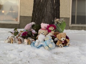 A memorial grew larger on Saturday, Dec. 8, 2018 outside a building where two young children were found slain on Wednesday, Dec.  5, 2018. Autopsy results released on Monday Dec. 10, 2018 stated the girls were stabbed to death.