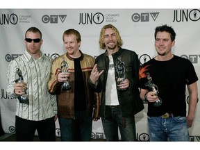 Nickelback poses with their Juno awards backstage at the 2004 Juno Awards Ceremony at Rexall Place in Edmonton on April 4, 2004.