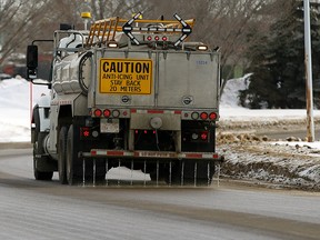 A City of Edmonton truck applies a calcium chloride anti-icing solution to the road.