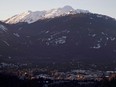 The village of Whistler, B.C. is seen as the sun sets on the snow capped mountains Friday, Feb. 3, 2012. The resort town is learning the hard way that getting involved in the emotionally charged fight between environmentalists and oil companies can result in negative consequences.