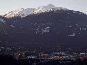 The village of Whistler, B.C. is seen as the sun sets on the snow capped mountains Friday, Feb. 3, 2012. The resort town is learning the hard way that getting involved in the emotionally charged fight between environmentalists and oil companies can result in negative consequences.