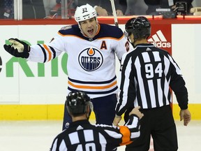 Edmonton Oilers forward Milan Lucic disputes his third-period charging penalty against the Winnipeg Jets in Winnipeg on Tues., Oct. 16, 2018.