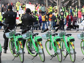 A group of protesters wearing yellow vests are filmed by Calgary Police Service Public Safety Unit members as they gather on Macleod Tr S across from city hall in Calgary on Saturday, December 15, 2018. Jim Wells/Postmedia