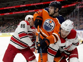 The Edmonton Oilers' Leon Draisaitl (29) battles the Carolina Hurricanes Teuvo Teravainen (86) and Brett Pesce (22) during first period NHL action at Rogers Place, in Edmonton Sunday Jan. 20, 2019.