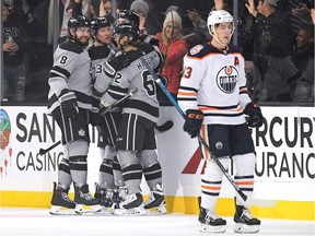 Tyler Toffoli of the Los Angeles Kings celebrates his goal with teammates Drew Doughty, Adrian Kempe and Carl Hagelin behind Ryan Nugent-Hopkins of the Edmonton Oilers on Jan. 5, 2019, during NHL action at Staples Center in Los Angeles.