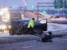 Police investigate at the scene of a two-vehicle collision along northbound 91 Street south of  Anthony Henday Drive in Edmonton on Friday, Jan. 4, 2019.