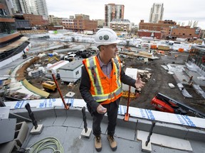 President of Katz Group Real Estate Glen Scott gives the media a tour of Stantec Tower and the Ice District public plaza (visible behind him), in downtown Edmonton Thursday Sept. 27, 2018.