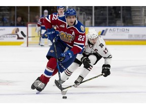 The Edmonton Oil Kings' Matthew Robertson (22) is chased by the Red Deer Rebels' Reese Johnson (17) during first period WHL action at Rogers Place, in Edmonton Friday Oct. 19, 2018.