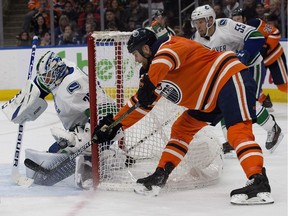 The Edmonton Oilers' Zack Kassian (44) is stopped by the Vancouver Canucks' goalie Jacob Markstrom (25) during second period NHL action at Rogers Place, in Edmonton Thursday Dec. 27, 2018.