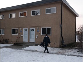 A pedestrian looks at the scene where a police-involved shooting occurred near 47A Street and 101A Avenue, in Edmonton on Thursday Jan. 3, 2019.