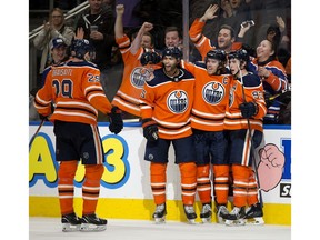 The Edmonton Oilers' Leon Draisaitl (29), Darnell Nurse (25), Connor McDavid (97) and Ryan Nugent-Hopkins (93) celebrate McDavid's game tying goal against the Florida Panthers during third period NHL action at Rogers Place, in Edmonton Thursday Jan. 10, 2019.