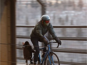 A cyclist crosses the High Level Bridge on a cold day in Edmonton, on Monday, Jan. 28, 2019.