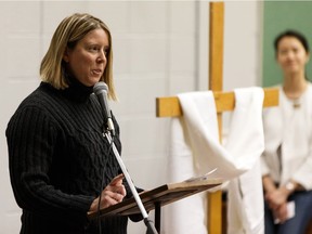 Parent Kerry McKinistry speaks during a public meeting about the potential closure of St. Gabriel Catholic School in Edmonton, on Wednesday, Jan. 30, 2019. McKinistry has three adoptive children attending the school.