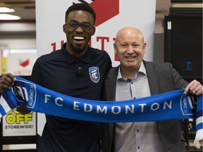 Tom Ameobi and FC Edmonton Head Coach and Director of Soccer Operations Jeff Paulus pose for a photo during a press conference where it was officially announced that Ameobi is returning to FC Edmonton, in Edmonton Thursday Jan. 31, 2019.