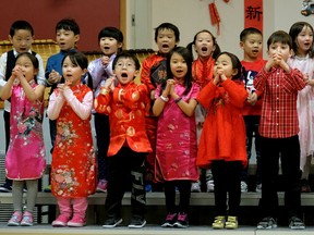 Grade 1 students perform a song during Chinese New Year celebrations at Meadowlark Elementary School in Edmonton on Feb. 16, 2018, the first day in the new Year of the Dog.