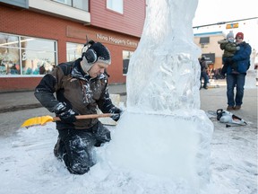 Kelly Davies works on an ice sculpture during Deep Freeze on Sunday, Jan. 13.