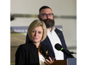 Premier Rachel Notley speaks as Municipal Affairs Minister Shaye Anderson, MLA for Leduc-Beaumont, listens on Friday, Jan. 25, 2019, during her announcement of a new interchange at 65 Avenue and Highway 2 in Leduc that will create 8,300 jobs, attract $600 million in new investment and keep people and products moving safely.