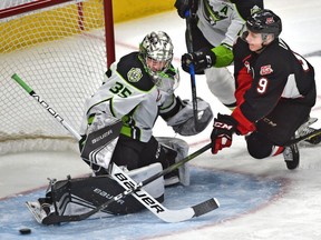 Edmonton Oil Kings goalie Todd Scott (35) makes a save on Prince George Cougars Tyson Upper (9) during WHL action at Rogers Place in Edmonton on Jan. 27, 2019.