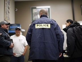 RCMP members await a meeting with hereditary chiefs and Coastal GasLink representatives to discuss ways of ending the pipeline impasse on Wet'suwet'en land during meetings at the office of the Wet'suwet'en First Nation in Smithers on Thursday, January 10, 2019.