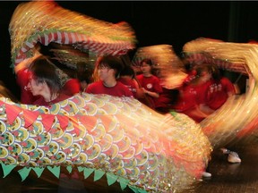 McNally school students perform a Dragon dance during the opening ceremony for the Confucius Institute in Edmonton, at the Alberta School for the Deaf. File photo.