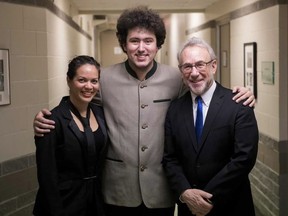 New assistant conductor Cosette Justo Valdés, left, who flew in on Tuesday to take up her new position at the Edmonton Symphony Orchestra in the Last Night of the Proms performance, with chief conductor Alex Prior and Robert Bernhardt, right, who conducted at the Winspear Centre on Friday, Jan. 18, 2019.