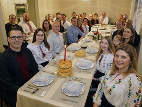 Paul Jereniuk, front left, and his wife Marsha Jereniuk, front right, hosted a family dinner on Ukrainian Christmas Eve, Sunday, Jan. 6, 2019, to celebrate Ukrainian and Orthodox Christmas for about 35 extended family members.