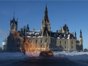 The Centennial flame burns outside West Block as Parliament resumes in Ottawa, Monday January 28, 2019. Parliament will sit in West block for approximately 10 years as Centre Block is renovated.