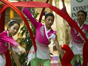 Fan dancers from Londonderry School and Kildare School perform during Global Confucius Institute Day at the Centre for Education in Edmonton, Alta. File photo.