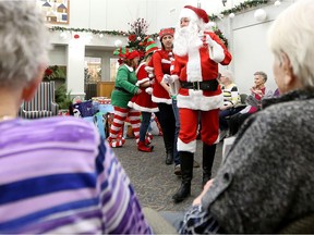 Santa and his elves dance and sing during a visit to McConnell Place North, 9113 - 144 Ave. File photo.