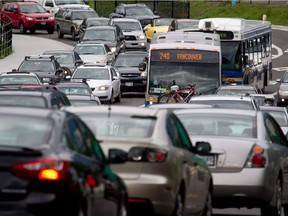 Motorists merge from four lanes into one as they enter the Lions Gate Bridge to drive into Vancouver, B.C. File photo.