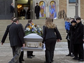 The family of Gene Zwozdesky (right) stand beside the casket carrying the body of Gene Zwozdesky outside the Ukrainian Orthodox Cathedral of St. John in Edmonton where a funeral service was held on Wednesday January 16, 2019. The former Speaker of the Alberta Legislature and long-time politician died Sunday January 6, 2019 at the age of 70.
