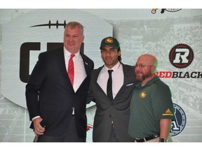 Diego Jair Viamontes, a receiver with the Mayas of the Liga de Futbol Americano Profesional, poses with Canadian Football League commissioner Randy Ambrosie, left, and Edmonton Eskimos player personnel director David Turner, right, after becoming the first-overall selection in the inaugural CFL-LFA draft Monday in Mexico City. (Dan Barnes/Postmedia)