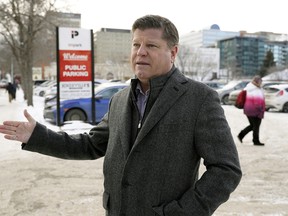 Brad Clough, a land developer with Allard Developments Inc., talks on 107 Street north of Jasper Avenue about the City of Edmonton's plans to expropriate his company’s land in downtown Edmonton to build a public park.