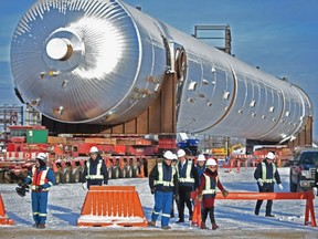 With a 820-tonne polypropylene splitter in back, dignitaries visit Inter Pipeline’s Heartland Petrochemical Complex, a $3.5-billion private-sector investment spurred by the province’s royalty credit program, on Jan. 10, 2019.