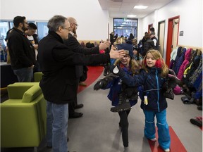 °Mill Creek School students pack up their belongings and move over to their brand new school building on Wednesday, Jan. 23, 2019, in Edmonton. The Mill Creek replacement school has been under construction since October 2017, and this is the first time students have seen the inside of their new classrooms.
