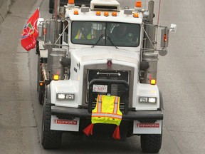 A protest convoy moves northbound along Macleod Tr near 30 Ave SW in Calgary on Saturday, January 12, 2019. Many of the vehicles displayed pro gas/ oil messages. Calgary Police provided an escort to ensure traffic was moving properly. Jim Wells/Postmedia