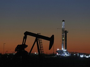 This Oct. 9, 2018, file photo shows an oil rig and pump jack in Midland, Texas. (Jacob Ford/Odessa American via AP, File) ORG XMIT: TXODE401