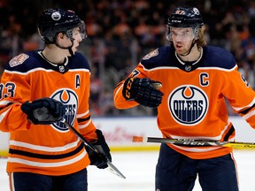 Edmonton Oilers teammates Ryan Nugent-Hopkins, left, and Connor McDavid during NHL action on Jan. 10, 2019, against the Florida Panthers at Rogers Place.