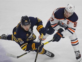 Buffalo Sabres Jack Eichel (15) and Edmonton Oilers' Conor McDavid (97) vie for the puck during the third period of an NHL hockey game, Friday Nov. 24, 2017, in Buffalo, N.Y.