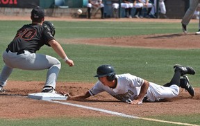 Edmonton Prospects short stop Zane Takhar (6) dives back to first base avoiding the tag by Fort McMurray Gaints Zachary Koroneos (20) on a pick-off play at first base, in their final regular WMBL season game at Re/Max Field in Edmonton, July 29, 2018. Ed Kaiser/Postmedia