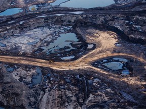 The Suncor Energy Inc. Millennium mine is seen in this aerial photograph taken above the Athabasca oilsands near Fort McMurray, Alberta.