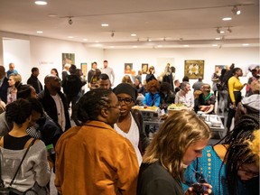 People mingle during 5 Artists 1 Love at the Art Gallery of Alberta on Saturday, Feb. 2.