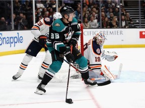 Leon Draisaitl #29 and Mikko Koskinen #19 of the Edmonton Oilers defend against Jakob Silfverberg #33 of the Anaheim Ducks during the third period of a game at Honda Center on Nov. 23, 2018 in Anaheim, Calif.