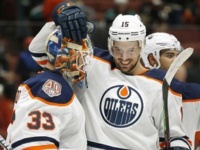 Alexander Petrovic of the Edmonton Oilers, right, and Cam Talbot of celebrate their team's 4-0 win over the Anaheim Ducks at Honda Center on Jan. 6, 2019 in Anaheim, Calif.