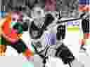 PHILADELPHIA, PENNSYLVANIA - FEBRUARY 02: Jesse Puljujarvi #98 of the Edmonton Oilers gets a stick under the arm from Ivan Provorov #9 of the Philadelphia Flyers at Wells Fargo Center on February 02, 2019 in Philadelphia, Pennsylvania.