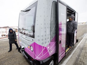 Operator Gerardo Moreno (right) waits for passengers prior to a press conference to launch an Electric Autonomous Vehicle (ELA) pilot project at Blatchford Tower, 29 Airport Road, in Edmonton Tuesday Oct. 9, 2018. The pilot project, which runs from October 9 to November 4, will give Edmontonians a chance to ride in the driverless shuttle. Edmontonians can book a ride on ELA at www.ridewithela.ca