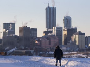 A pedestrian walks along Strathearn Crescent near 87 Street, in Edmonton Wednesday Feb. 6, 2019.