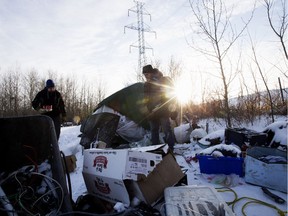 (left to right) Boyle Community Services Street Outreach members Damien Lachat and Doug Cooke check on the welfare of a man camping in a south east Edmonton field, Thursday Feb. 7, 2019. The two had hoped to drive the man to a medical check-up, but the camp was empty.