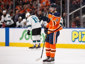 Edmonton Oilers' Connor McDavid (97) recognizes Zack Kassian (44) after he scored on San Jose Sharks' goaltender Aaron Dell (30) during the third period of a NHL game at Rogers Place in Edmonton, on Saturday, Feb. 9, 2019.